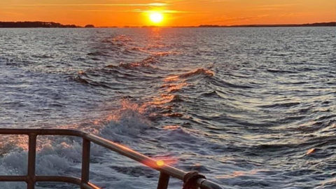 boat at sea at sunset