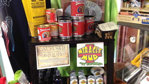 daufuskie general store shelves in a store with miracle mud and red cans