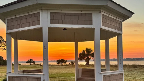 Discover the Melrose Oyster House & Beach Club. a gazebo overlooking the ocean